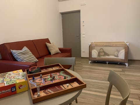 Family Quadruple Room, 1 Bedroom | Living room | 30-inch flat-screen TV with cable channels, TV