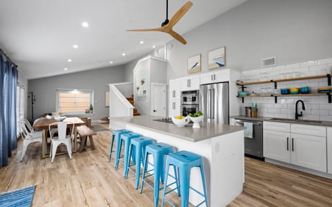 Bright & airy open kitchen/dining/living makes it easy to relax together.