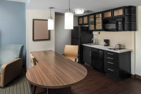 Suite, 1 Bedroom | Desk, blackout drapes, iron/ironing board, free cribs/infant beds