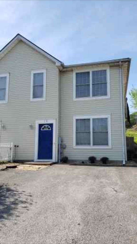Street view of home with 2 parking spaces.