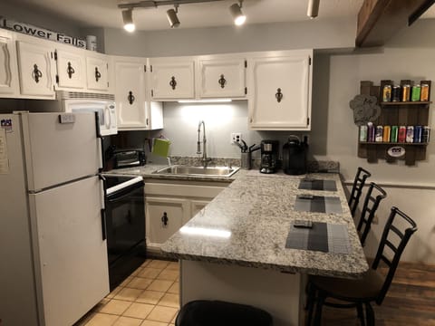 Everything you need! Including huge counter top with 3 bar stools 