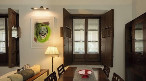 Dining area with a table and 4 chairs.