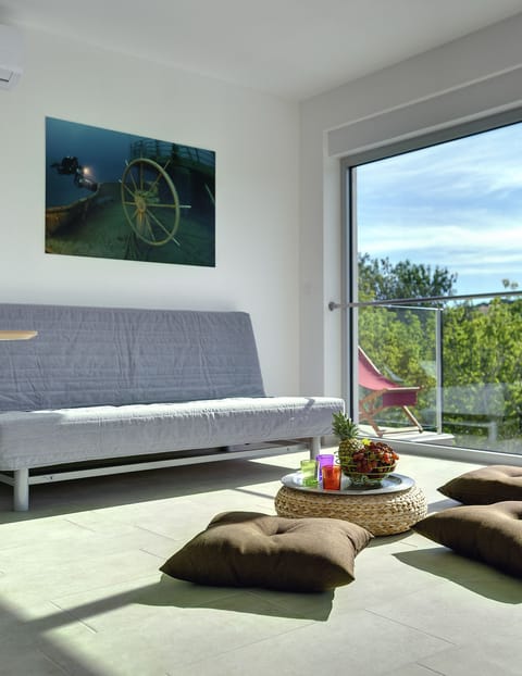 Suite, 2 Bedrooms, Balcony | Living area | Flat-screen TV