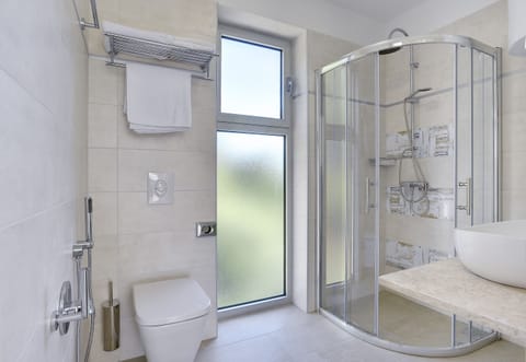 Shower, free toiletries, hair dryer, slippers