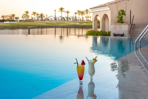 Seasonal outdoor pool, open 11:00 AM to 7:00 PM, pool umbrellas