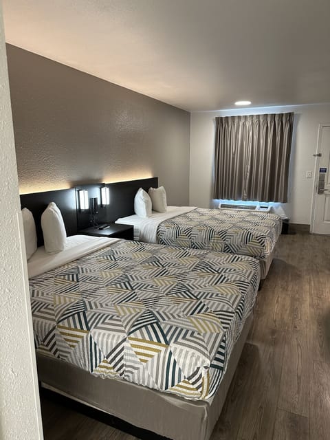 Desk, laptop workspace, iron/ironing board, free cribs/infant beds