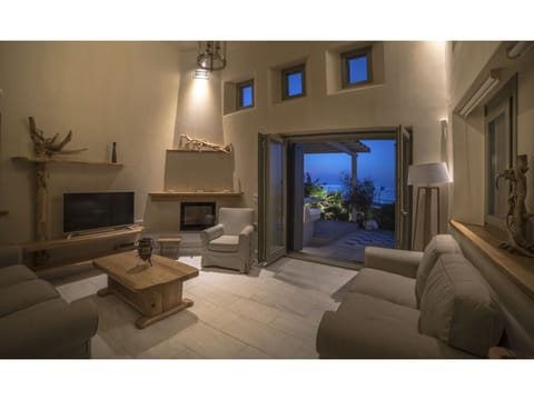 Luxury Villa, 3 Bedrooms, 2 Bathrooms, Beachfront | Living area | Flat-screen TV, fireplace