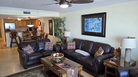 Comfortable,  leather couch, loveseat and chair with open concept floor plan