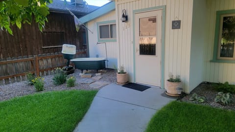 Newly landscaped front yard complete with fun yard art and water features!