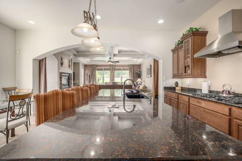 Super sized granite island, 5 burners gas cook top.