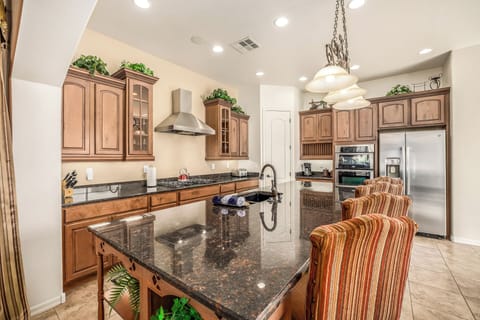 Gigantic kitchen island you can gather around during cooking with more seating.