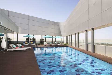 Outdoor pool, open 7:00 AM to 9:00 PM, pool umbrellas, sun loungers