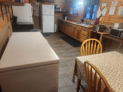 Large kitchen with 2 refrigerators, freezer, fish fryer and all the stuff