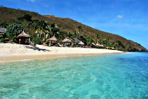 Private beach, white sand, sun loungers, beach umbrellas