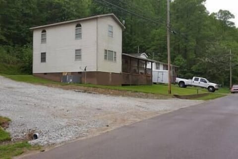 Side view of house and part of the second driveway 