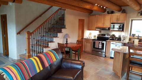 Stairs to Casita Master Bedroom/Bathroom, door on left connects to House