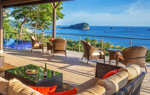 Panoramic ocean-view terrace perfect for large groups and sunset gatherings