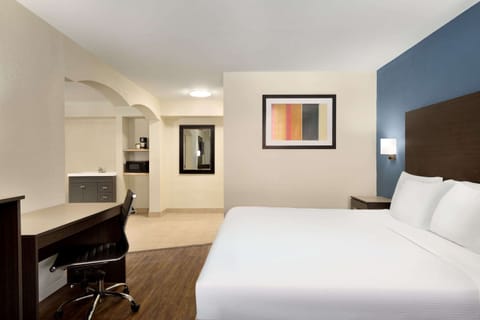 Suite, 1 King Bed, Smoking (One-Bedroom) | Desk, iron/ironing board, free cribs/infant beds, rollaway beds