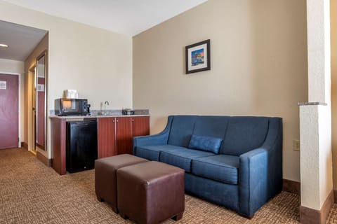 Desk, laptop workspace, blackout drapes, iron/ironing board