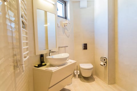 Shower, hair dryer, slippers, towels