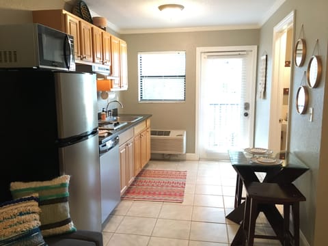 View of front door, kitchen and breakfast nook.