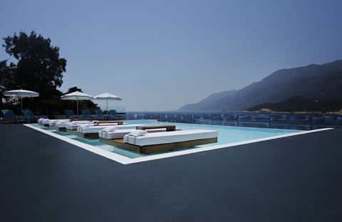 Seasonal outdoor pool, open 8:00 AM to 7:30 PM, pool umbrellas