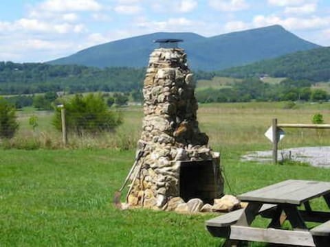 Enjoy an outdoor fireplace at Windymile - Lexington Virgina Cabin rental.