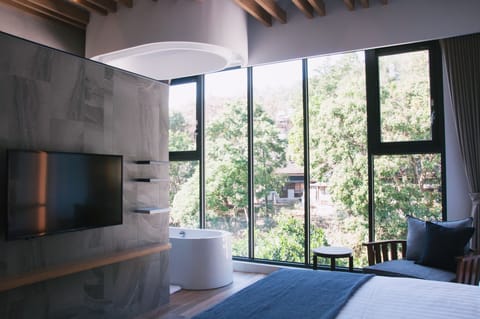 Deluxe Double Room, 1 Queen Bed, Non Smoking, Hill View | Desk, laptop workspace, blackout drapes, soundproofing