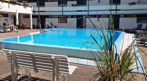 Seasonal outdoor pool, a heated pool, sun loungers