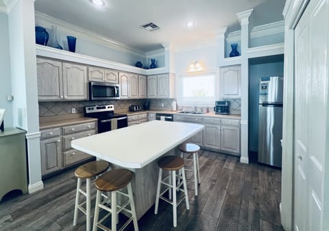 Well designed and equipped kitchen with island and pantry. Open plan & spacious.