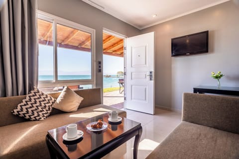Superior Condo, Sea View | Living area | TV