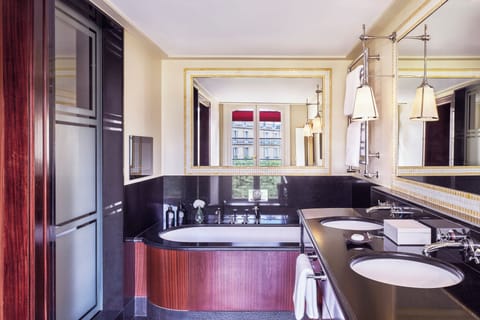 Separate tub and shower, rainfall showerhead, designer toiletries