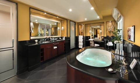 Separate tub and shower, rainfall showerhead, designer toiletries