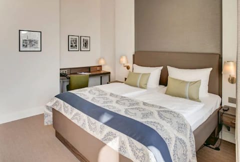 Premium bedding, down comforters, pillowtop beds, in-room safe