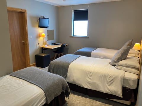 Triple Room | Desk, blackout drapes, iron/ironing board, cribs/infant beds