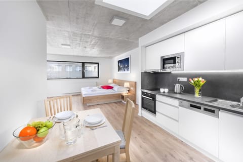 Executive Studio, 1 King Bed, Kitchen, City View | Living area | 43-inch flat-screen TV with cable channels, TV