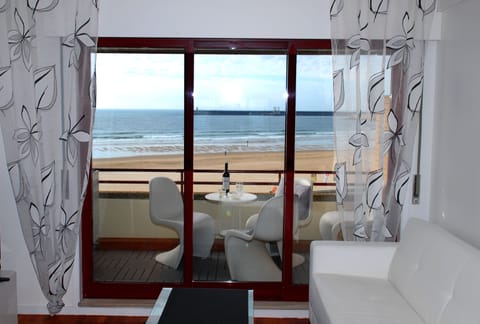 Apartment, 1 Bedroom, Sea View | Living room | Flat-screen TV