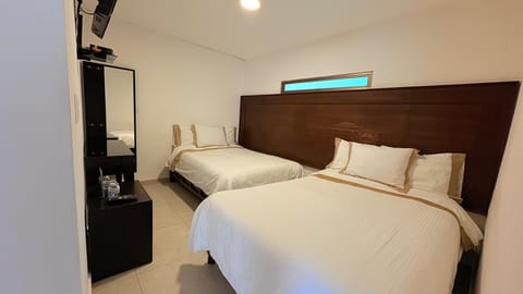 Standard Room | Down comforters, individually furnished, desk, laptop workspace