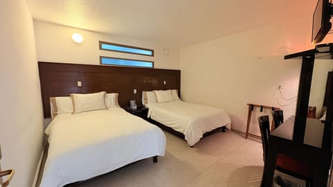 Superior Quadruple Room | Down comforters, individually furnished, desk, laptop workspace