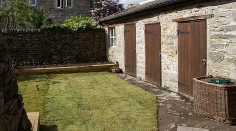 Newly laid garden and bike storage.