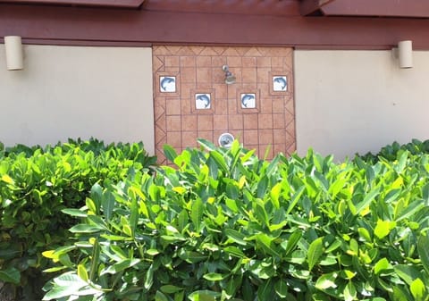 Outdoor showers with adjoining men's and women's restrooms.