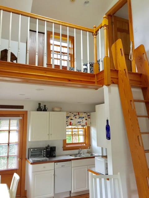 Back door leads onto private deck: bistro table, gas grill & outdoor shower