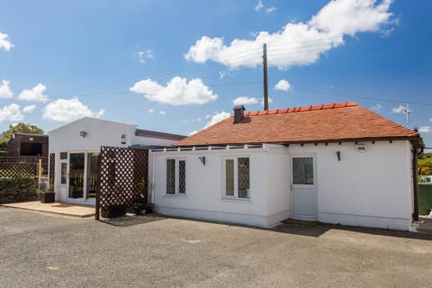 Section of cottage containing kitchen and shower room.