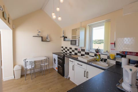 Breakfast table,crockery,cutlery,cleaning products, tea towels,dish cloth etc.