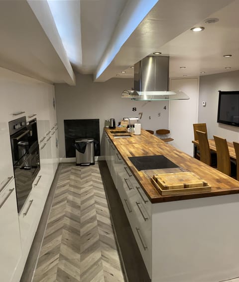 Basement kitchen accessed via spiral staircase