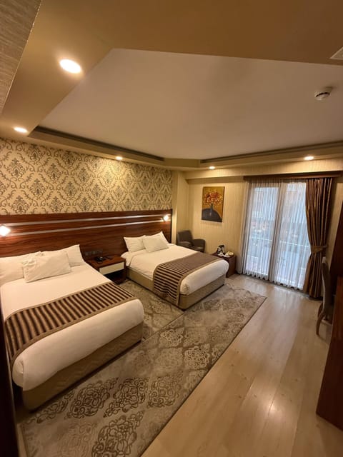Family Triple Room | Premium bedding, minibar, in-room safe, desk