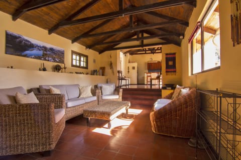 Spacious living room with wood-beamed 