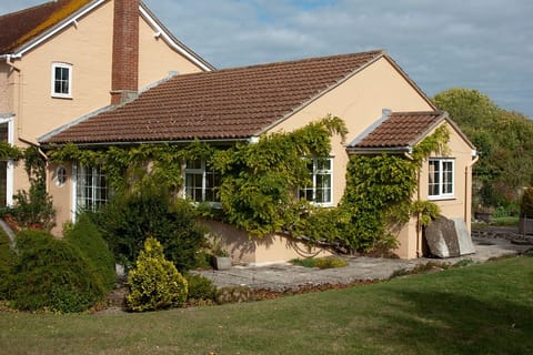 Guests can access the patio and garden via the sitting roomFrench doors.