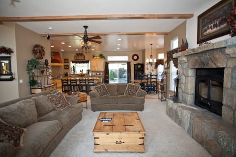 Large living/great room with a beautiful split face rock fireplace