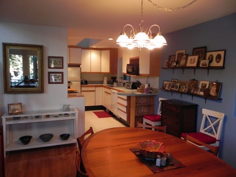 Dining room opens to a well furnished kitchen with lots of storage space.
